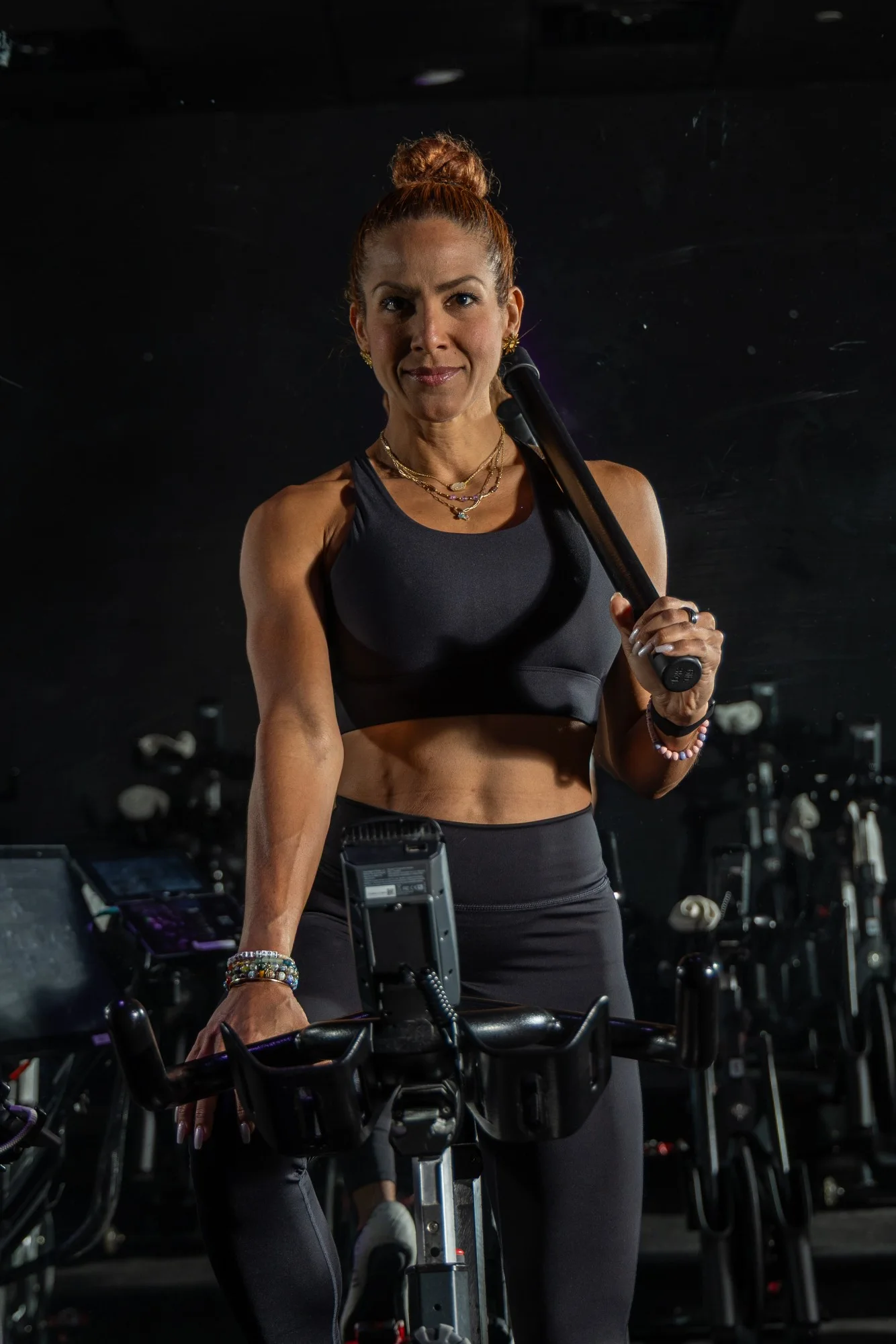 CycleBar Sugar Land instructor with headset microphone during a brand session