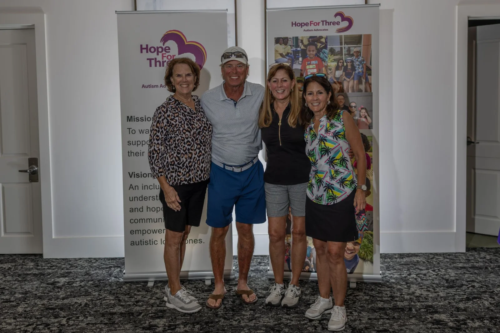 Women's foursome photographed at the tee box