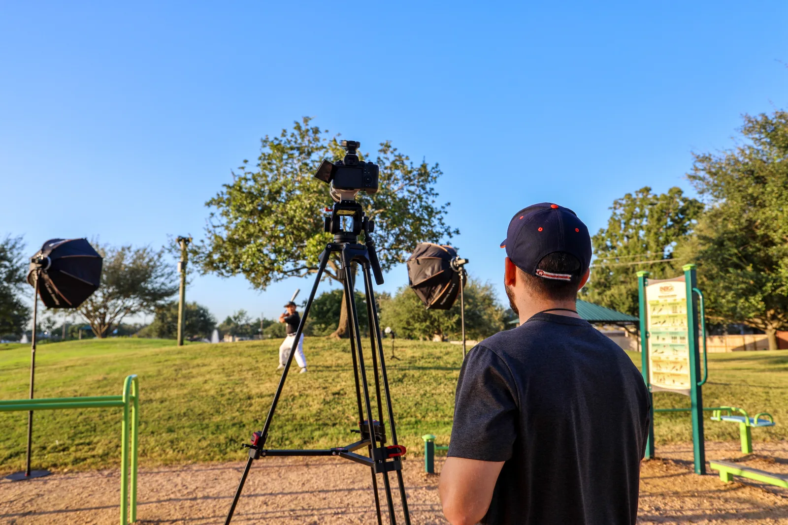 Young athlete lit by two softboxes with the photographer at a fixed camera position