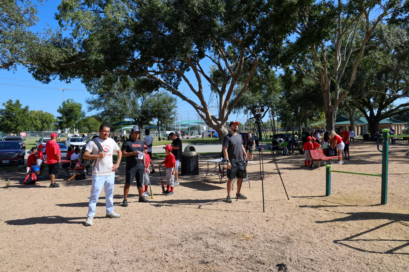 Wide view of the park during media day with teams, families, and the capture station