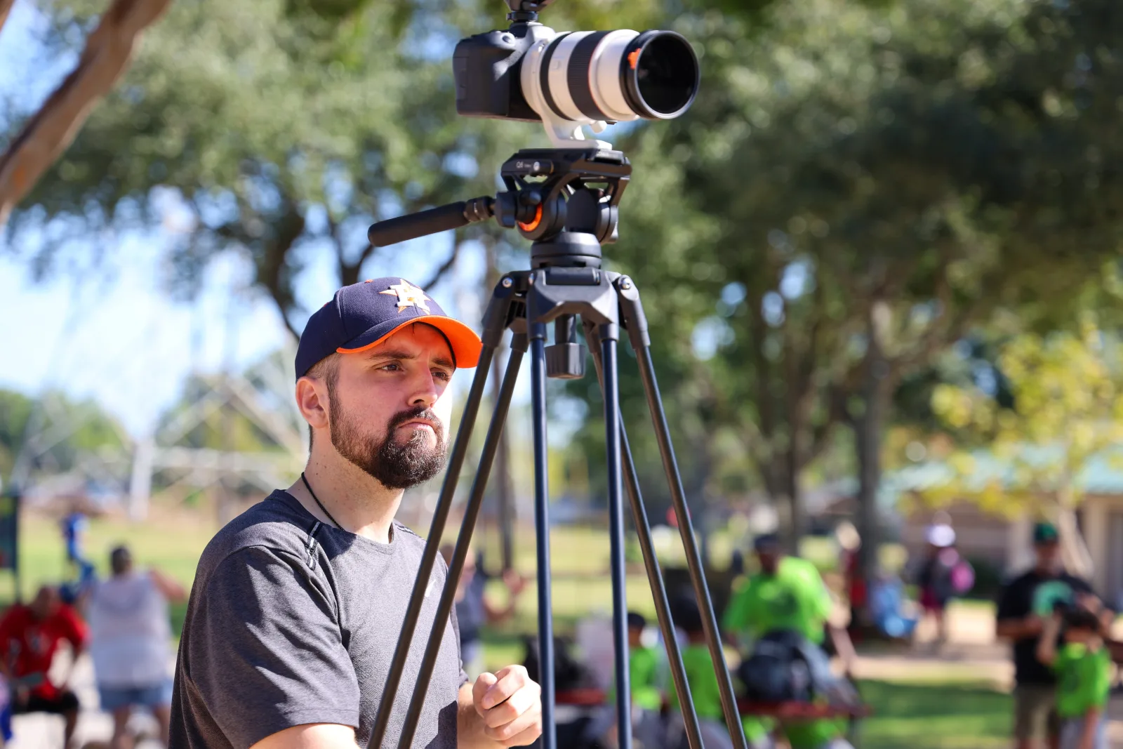 Photographer concentrating at the camera during a capture