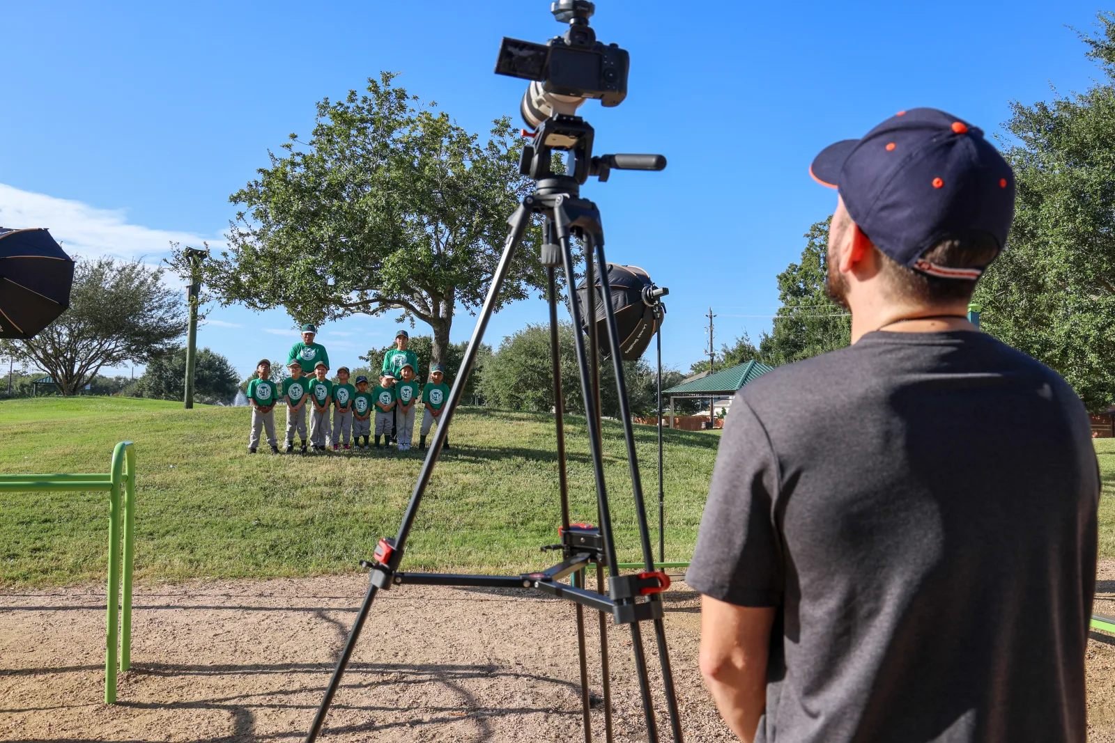 Wide frame of a team lined up in the distance with the camera in the foreground
