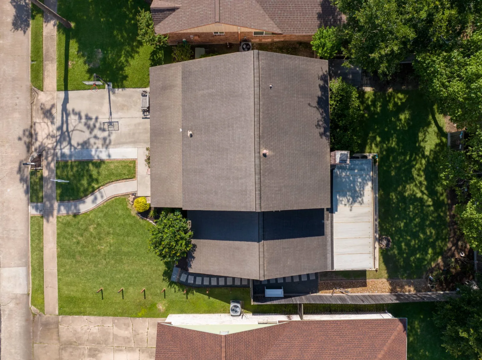 Overhead drone frame showing the full lot boundaries of a Meadows Place property